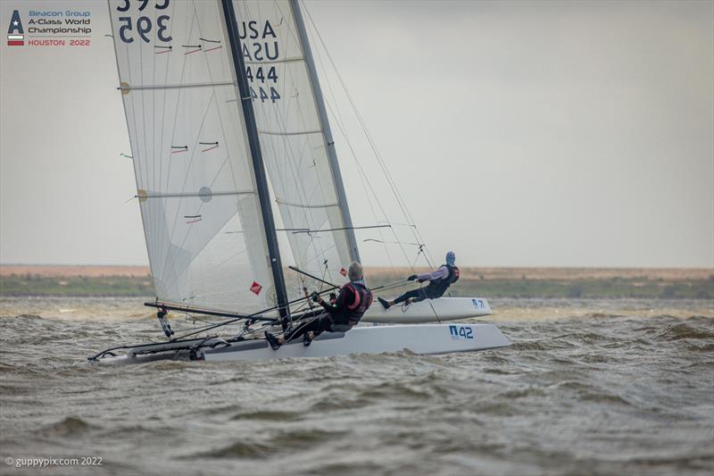 Micheal Love USA 395 and Greg Matthews USA 444 battling each other on day 3 of the Beacon Group A-Class Catamaran World Championships in Texas photo copyright Gordon Upton / www.guppypix.com taken at Houston Yacht Club and featuring the A Class Catamaran class