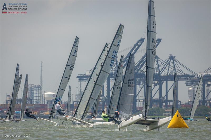 The chasing pack round the top mark in race 2 on the final day at the Beacon Group A-Class Catamaran World Championships in Texas photo copyright Gordon Upton / www.guppypix.com taken at Houston Yacht Club and featuring the A Class Catamaran class