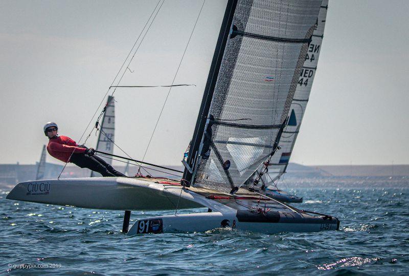 Looking ahead to the 2022 A-Class Cat European Championships - German lake sailor, Katrin Brunner, in the Open catagory photo copyright Gordon Upton / www.guppypix.com taken at  and featuring the A Class Catamaran class