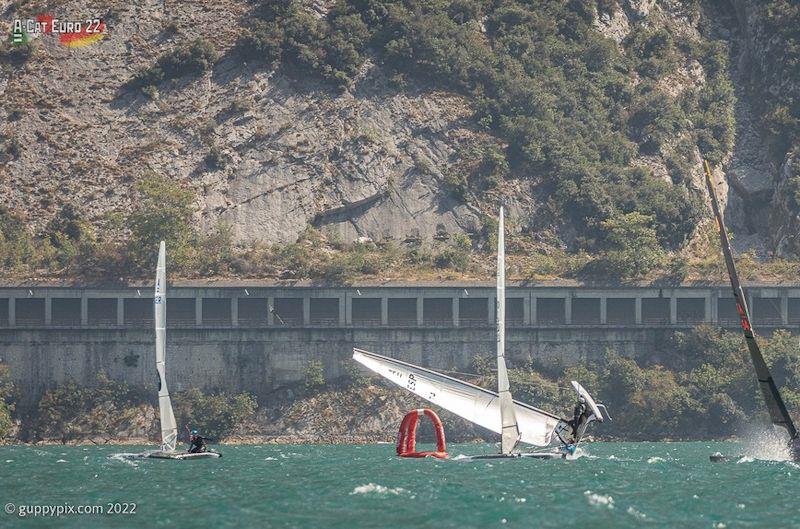 Abdon Luiz Paez about to capsize onto a spreader mark - A-Class European Championships day 4 photo copyright Gordon Upton / www.guppypix.com taken at Circolo Vela Arco and featuring the A Class Catamaran class