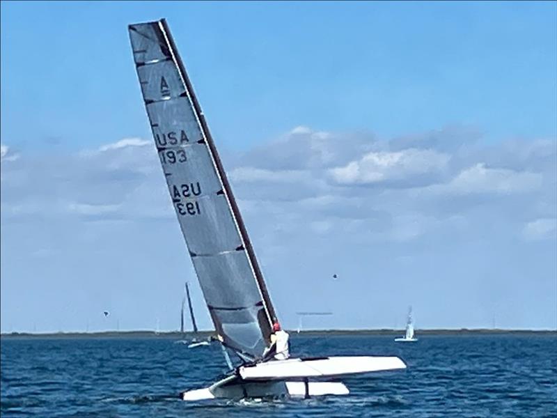 Chris Brwon flying a hull during the 2023 A-Class Midwinters photo copyright Mike Austin taken at Upper Keys Sailing Club and featuring the A Class Catamaran class