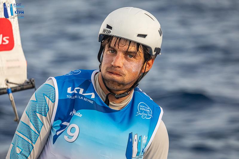 A-Cat Worlds at Toulon, France Day 3 - Polish sailor Kuba Surowiec discovers his OCS cancels out his race win, but is now joint first in the Open fleet after not letting it effect him and got a pair of second places later - photo © Gordon Upton / www.guppypix.com