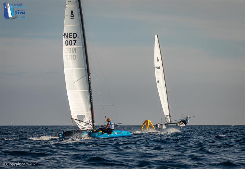 A-Cat Worlds at Toulon, France Day 4 - Kuba Surowiec POL 41 show a clean pair of heels to Mischa Heemskerk NED 7 in the Open fleet battle. Both went into the race on equal points photo copyright Gordon Upton / www.guppypix.com taken at Yacht Club de Toulon and featuring the A Class Catamaran class