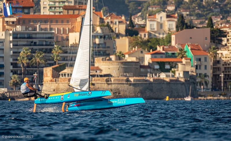 A-Cat Worlds at Toulon, France Day 4 - Mischa rounds the top spreader mark, just off Fort Saint Louis along the Toulon seafront and many interested spectators photo copyright Gordon Upton / www.guppypix.com taken at Yacht Club de Toulon and featuring the A Class Catamaran class