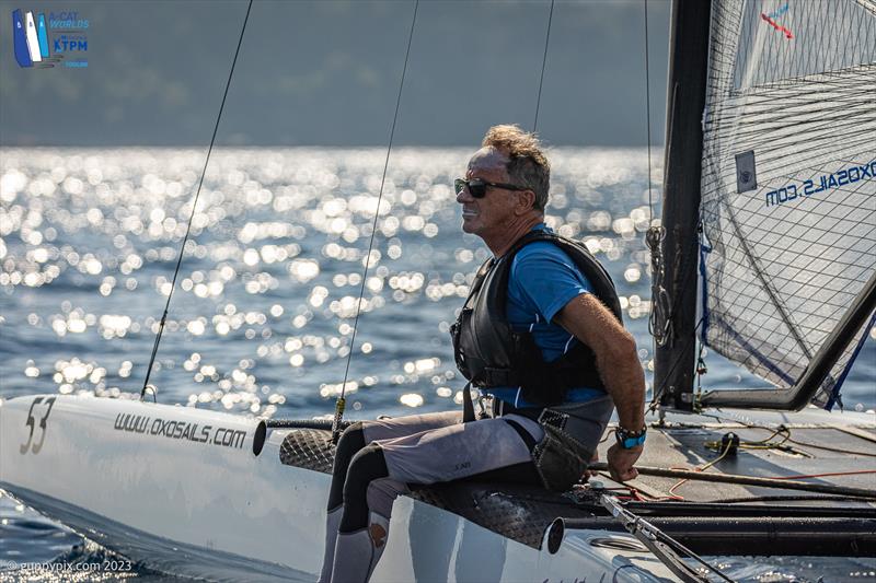 A-Cat Worlds at Toulon, France Day 5 - Manuel Vaccari ITA 5 looks on wistfully at the windless state for the Classic fleet photo copyright Gordon Upton / www.guppypix.com taken at Yacht Club de Toulon and featuring the A Class Catamaran class