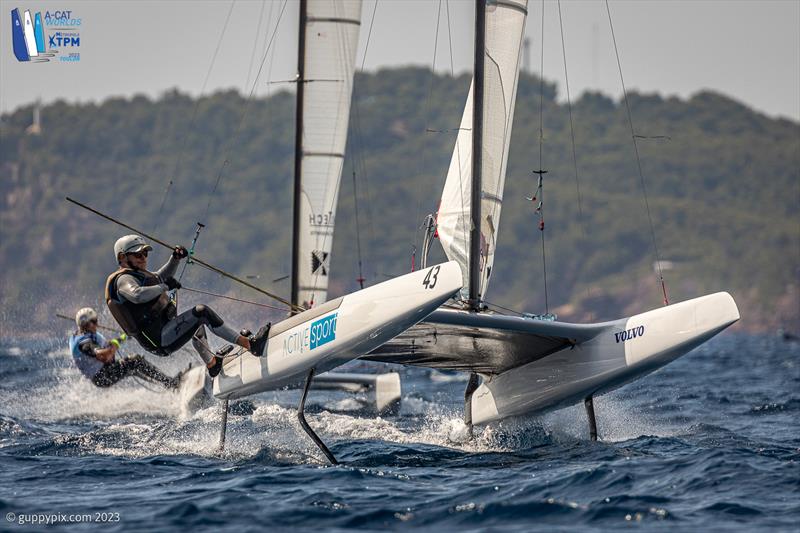 A-Cat Worlds at Toulon, France Day 5 - Toni Ballester Martinavarro ESP 75 gets loose at the top mark photo copyright Gordon Upton / www.guppypix.com taken at Yacht Club de Toulon and featuring the A Class Catamaran class
