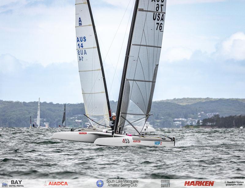 Australian A-Cat Nationals on Lake Macquarie Day 2 - Ravi just crosses ahead of a chasing Adam Beattie at the finish - photo © Gordon Upton