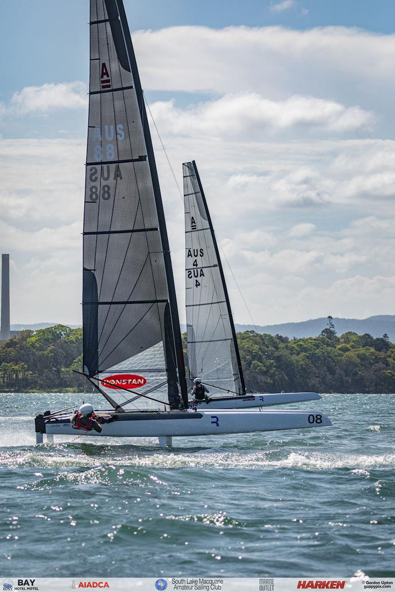 Australian A-Cat Nationals on Lake Macquarie Day 3 - Two sailing legends, AUS 88 Darren Bundock and AUS 4 Stevie Brewin blast upwing after the start photo copyright Gordon Upton / www.guppypix.com taken at South Lake Macquarie Amateur Sailing Club and featuring the A Class Catamaran class