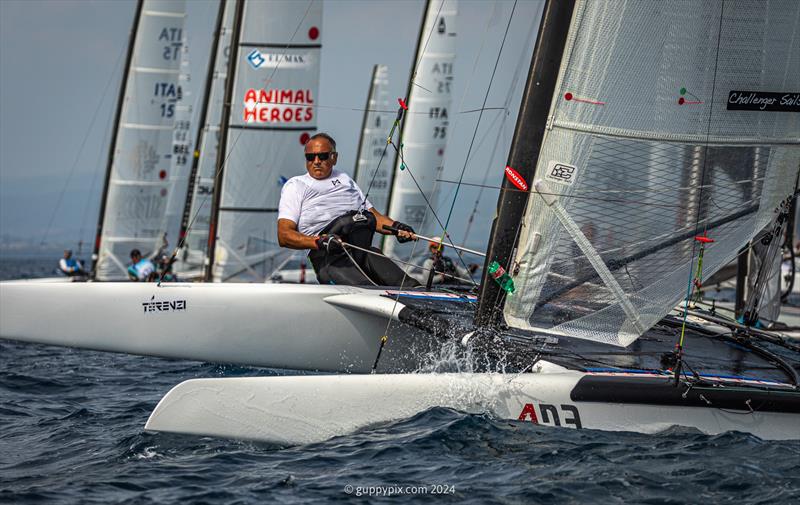 A Class Cat Regata Nazionale - Veteran Italian sailor Stefano Sirri, ITA 7, starting at the pin end here, had a good first day, ending in 3rd place overnight photo copyright Gordon Upton / www.guppypix.com taken at Centro Velico Punta Ala and featuring the A Class Catamaran class