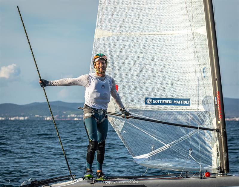 Italian National Champion, Lamberto Cesari, ITA 13, is on fast form coming into this Worlds and is expected to do well in Auckland photo copyright Gordon Upton / www.guppypix.com taken at Milford Cruising Club and featuring the A Class Catamaran class