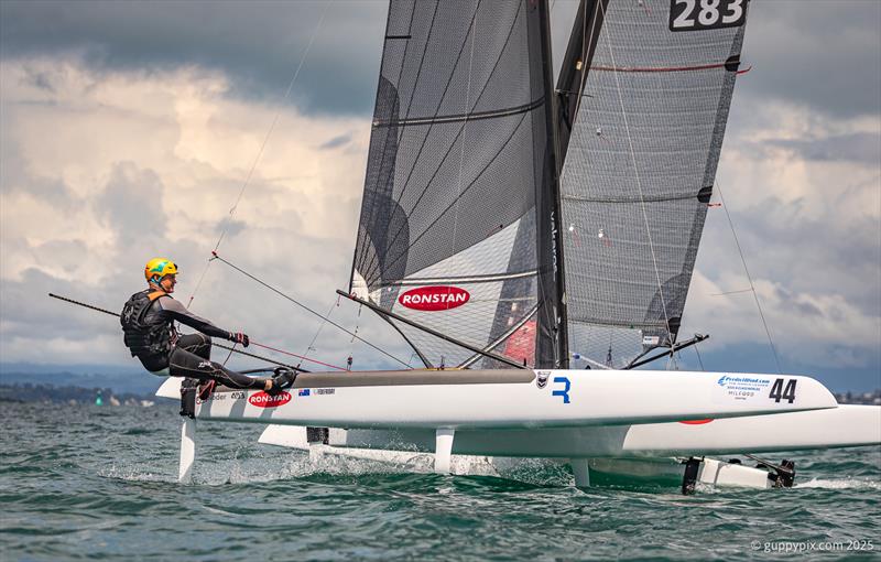 PredictWind A-Class Cat Worlds 2025 - Darren Bundock is looking to finally add this title to he extensive trophy cabinet photo copyright Gordon Upton / www.guppypix.com taken at Milford Cruising Club and featuring the A Class Catamaran class
