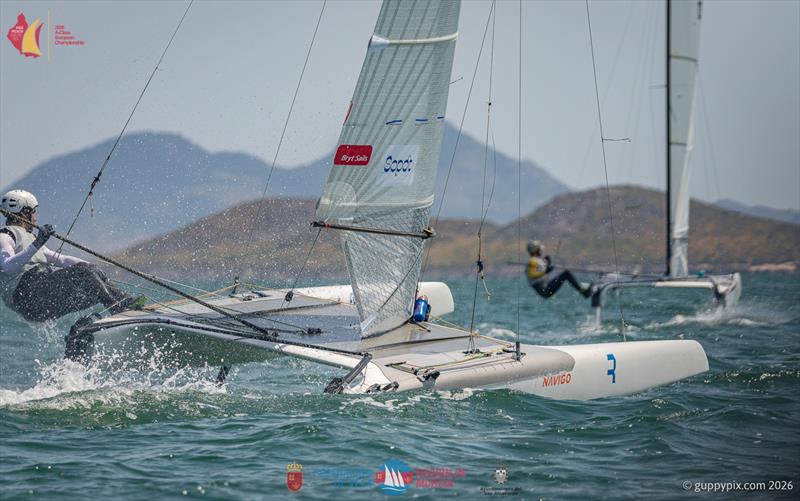 A Class Catamaran Europeans Day 1 - World Champ Kuba Surowiec POL trying to chase down ITA champ Lamberto Cesari in race 2, but Lamberto proved too strong in that race photo copyright Gordon Upton / www.guppypix.com taken at  and featuring the A Class Catamaran class