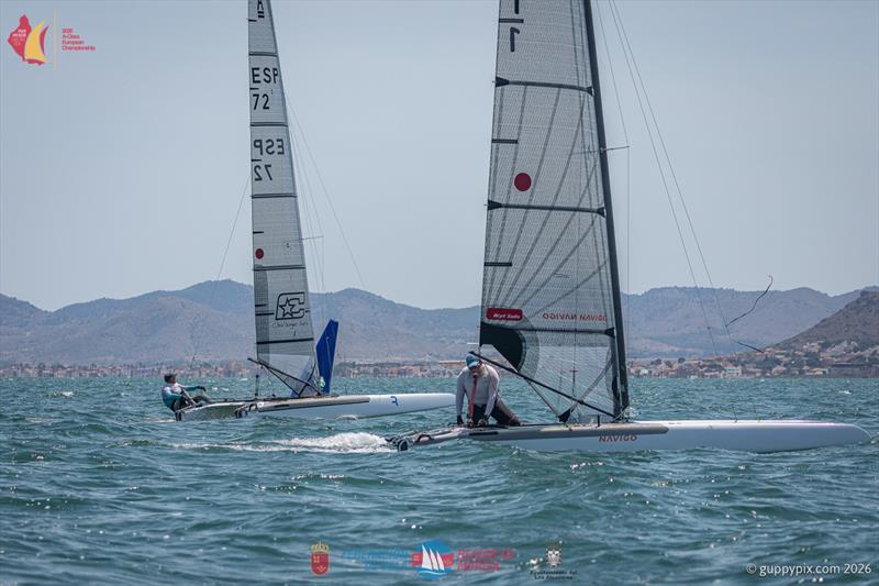 A Class Catamaran Europeans Day 1 - The narrowest on margins, just 400mm separated Jacek Noetzel, (nearest) from Gustavo Doreste ESP for the race win photo copyright Gordon Upton / www.guppypix.com taken at  and featuring the A Class Catamaran class