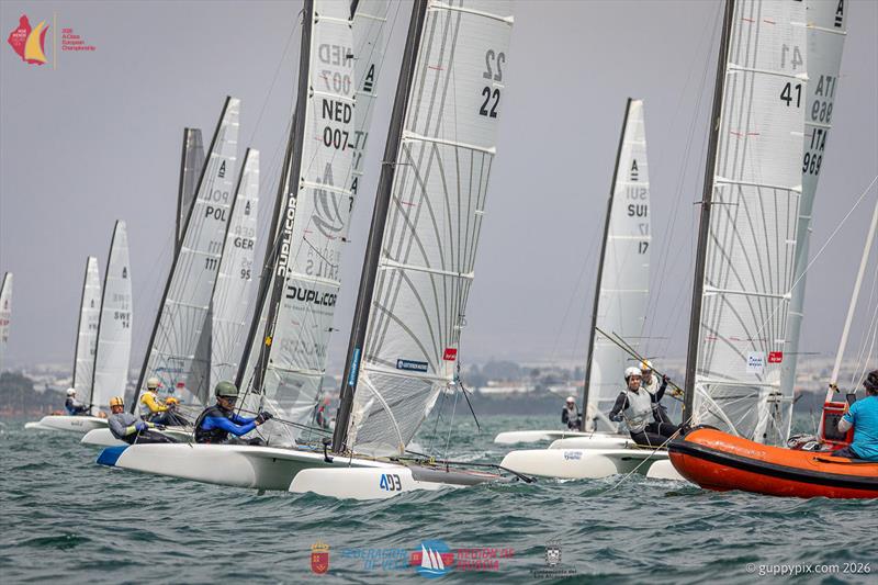 A Class Catamaran Europeans Day 4 - Joey Randle nails the pin in the first race of the day photo copyright Gordon Upton / www.guppypix.com taken at  and featuring the A Class Catamaran class