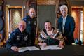 mirates Team New Zealand CEO Grant Dalton, and COO Kevin Shoebridge sign the Kotuitanga with Marama Royal, Chair of Ngati Whatua Orakei and kaumatua Alec Hawke - September 22, 2022