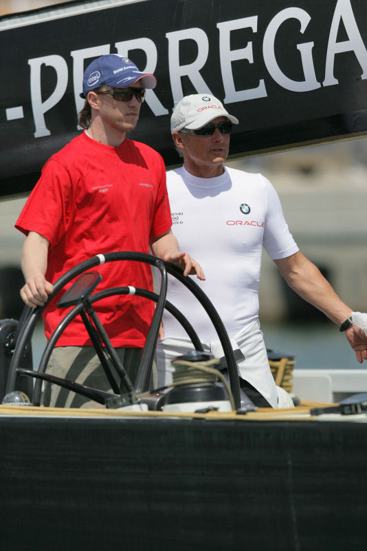 F1 driver Nick Heidfeld (left, BMW Sauber F1 Team) at the helm next to CEO and skipper Chris Dickson (right, BMW ORACLE Racing) during Valencia Louis Vuitton Act 10 photo copyright BMW ORACLE Racing / Gilles Martin-Raget taken at  and featuring the ACC class