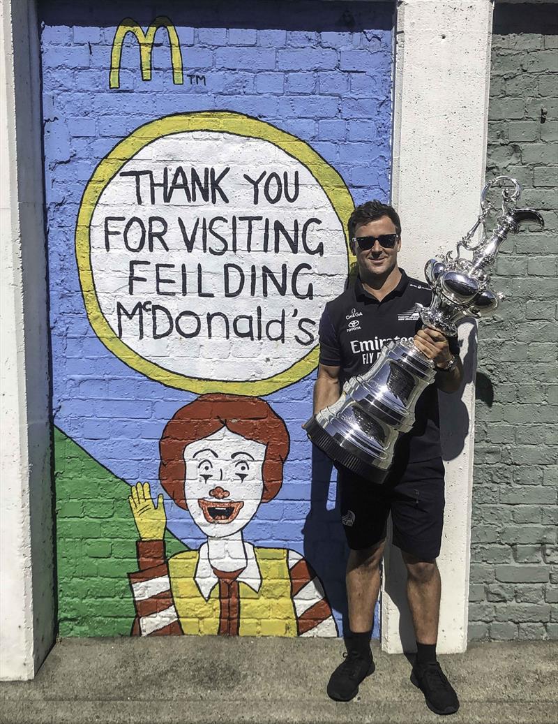 Local hero and team grinder Simon van Velthooven, along with the America's Cup trophy - McDonald's joins Emirates Team New Zealandas Official Family Partner  - February 2020 photo copyright Emirates Team New Zealand taken at Royal New Zealand Yacht Squadron and featuring the ACC class