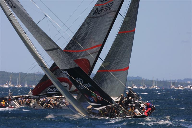  Alinghi crosses in front of Team New Zealand on the first leg of Race 1 of the America's Cup photo copyright Bob Grieser / Louis Vuitton taken at Société Nautique de Genève and featuring the ACC class