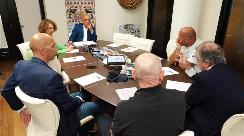 The August 22, 2022 meeting from left Stephano Ballero (ACE lawyer); lawyer for Sardinia Tourism, Giovanni Chessa, Mateo de Nora (ETNZ) and Grant Dalton (back to camera) photo copyright Sardinia Region taken at Circolo della Vela Sicilia and featuring the ACC class