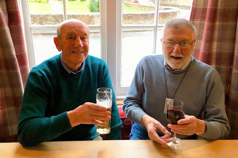 (L-R) Colin Brewer enjoys a drink with life-long friend, boatbuilder and designer John Mullins - photo © Mullins family