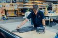 C-Tech founder and top skiff sailor Alex Vallings doing a scanner check on the new foils -- C-Tech build facility - September 2025 © C-Tech
