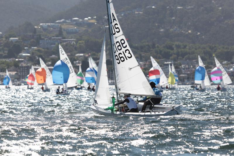 Little Devil (Archer Ibbott and Sam Hooper, Tas) leading the fleet of Cadets - International Cadet National Championships photo copyright Pete Harmsen taken at Sandy Bay Sailing Club and featuring the Cadet class