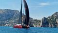 Lord Irvine Laidlaw's Gunboat 80 Highland Fling 18 passes the Faraglioni rocks en route to winning the race around Capri at the IMA Maxi Europeans