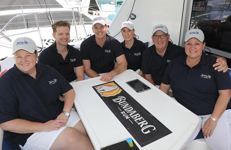 Living Life crew at Hamilton Island Race Week: Gavin Webb 2nd from the right photo copyright Crosbie Lorimer taken at Hamilton Island Yacht Club and featuring the Catamaran class