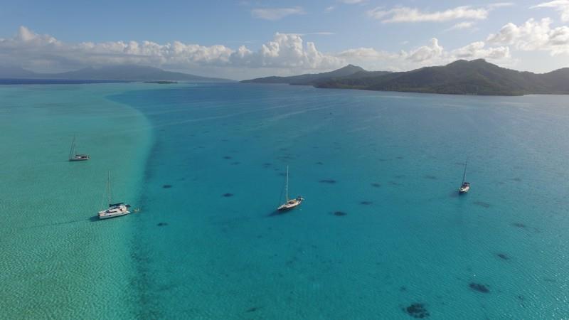 Left to right - SV Tourterelle, SV Two Drifters, SV Supertramp, SV Ocean Blue anchored off Ta'aha photo copyright Jenevora Swann taken at  and featuring the Catamaran class