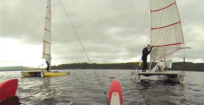 Band on the run: John Terry (behind the camera) and Gareth Ede chase down Gareth's dad, Stuart photo copyright John Terry taken at Kielder Water Sailing Club and featuring the Catapult class