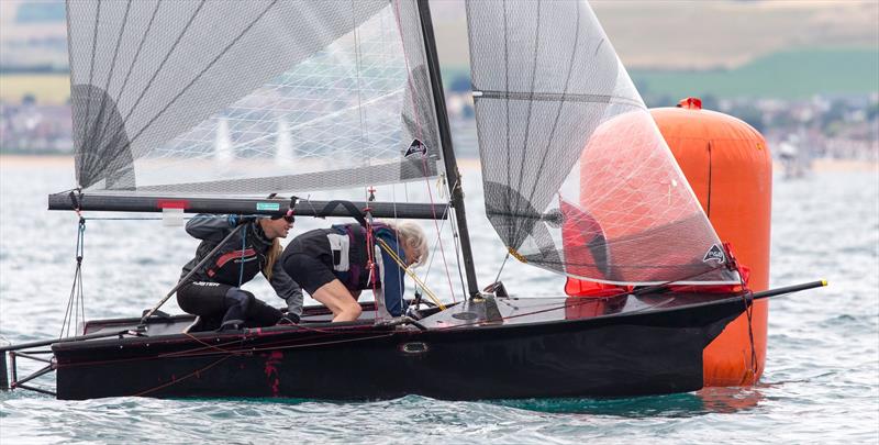 Cherubs at the Weymouth Dinghy Regatta - Martyne Denchfield and Una Rudman rounding the leeward mark in King Tubby photo copyright Richard White taken at Castle Cove Sailing Club and featuring the Cherub class