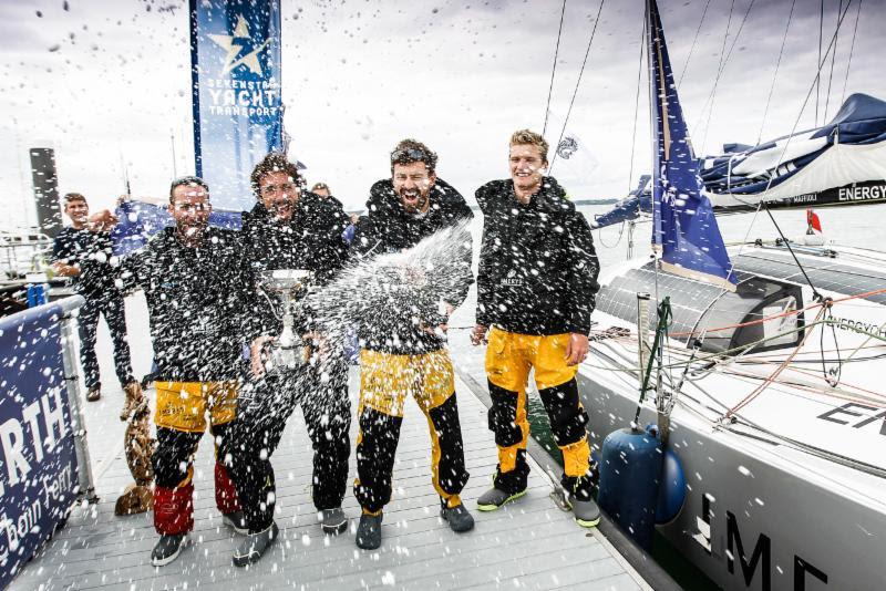 Champagne celebration for Imerys Clean Energy's Phil Sharp, Julien Pulvé, Pablo Santurdé and Sam Matson after completing the race in record time for a 40ft yacht photo copyright Paul Wyeth / RORC taken at Royal Ocean Racing Club and featuring the Class 40 class