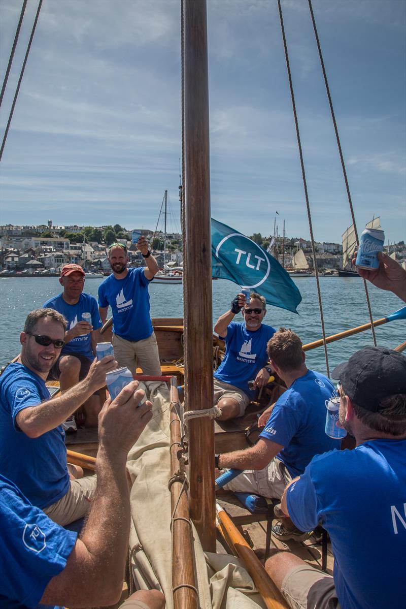 Celebrating their win, the crew of Bounty’s End taste victory with a cold Offshore Pilsner during the Bligh Boat Race at Tilley Endurables Falmouth Classics photo copyright Conrad Humphreys taken at St. Mawes Sailing Club and featuring the Classic Yachts class