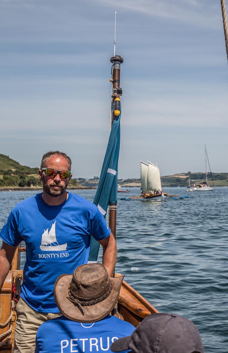 Bounty’s End skipper, Conrad Humphreys leading Bligh’s Tribute by a few lengths during the Bligh Boat Race at Tilley Endurables Falmouth Classics photo copyright Conrad Humphreys taken at St. Mawes Sailing Club and featuring the Classic Yachts class