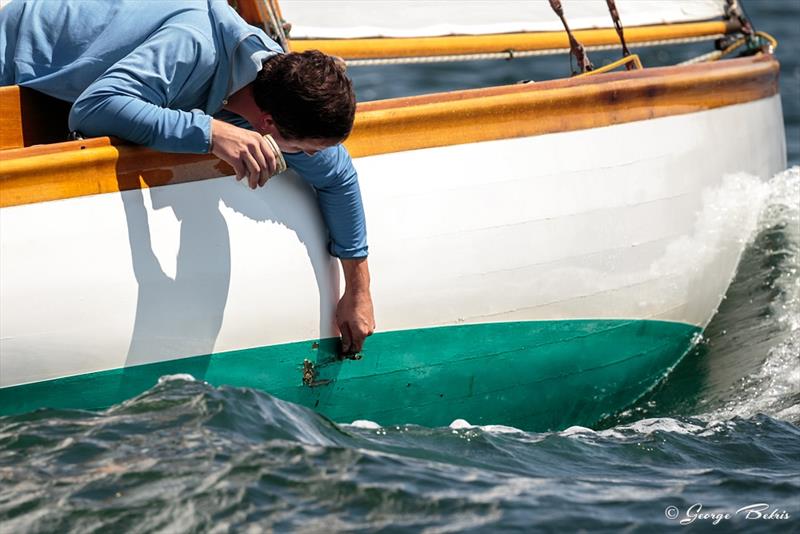 A spot of mid-race repair to Firefly in the Newport Classic Regatta 2018 photo copyright George Bekris / www.georgebekris.com taken at  and featuring the Classic Yachts class