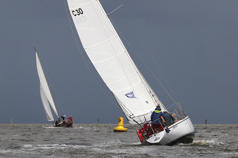 Baranne skippered by Peter Jerabek heading into one of the many showers we had today.  They had a third in race one and second in race two, so maybe a first tomorrow? - photo © A. J. McKinnon