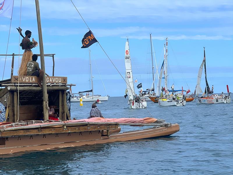 The Traditional Fiji DURA managed by the University of Fiji and captained by traditional navigator Setareki Ledua with the warrior with the conch shell “Start Gun” - photo © Don McIntyre / MGR2025