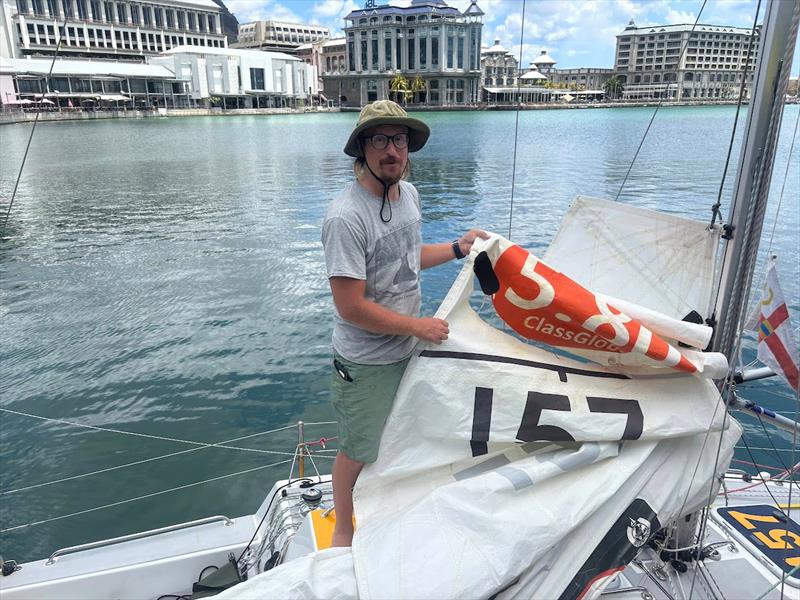 On 19 October 2025 Mauritius Port Louis, Josh Kali arrived to the Customs Dock. Josh pointed out the torn sail – a recent battle scar and said:”Nothing a McDonald's can't fix” - photo © Christine Turner / MGR2025