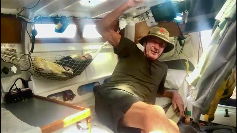 Exhausted after a rough night at sea, Eric fights sleep while filming a vlog update aboard Sunbear - photo © Eric Marsh / MGR2025