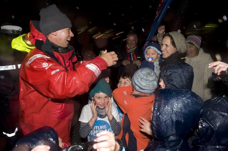 Dale Smyth arrives in Cape Town, greeting his wife (Nat) and children photo copyright Clipper Race taken at  and featuring the Clipper 70 class