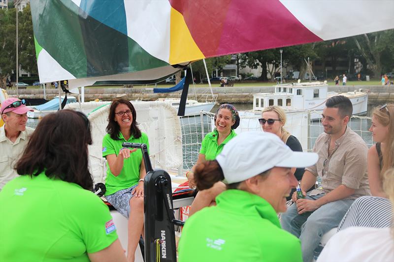 Shannon Dean (left) and Lizzie Howe (right) facing toward camera in green Visit Seattle tops - Clipper Round the World Yacht Race 2017-18 - photo © Clipper Race
