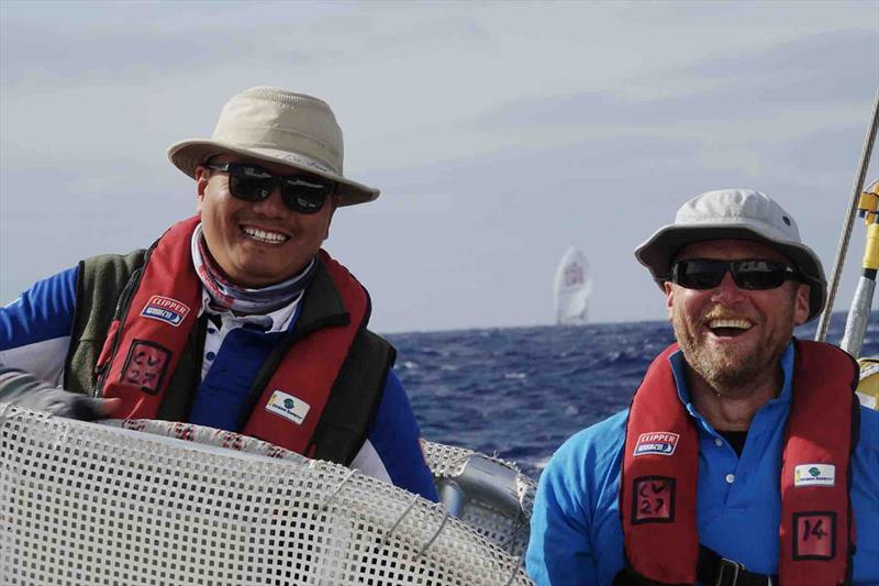On board media Ming captures crew on the helm with another Clipper Race yahct off the the stern of Sanya Serenity Coast photo copyright Ming taken at  and featuring the Clipper 70 class