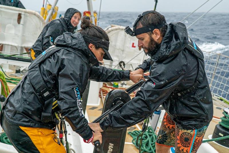 Michael Holmes and Lizzie Cave grinding while raining - The Clipper Race Leg 5 - Race 7, Day 7 photo copyright Maeva Bardy taken at  and featuring the Clipper 70 class