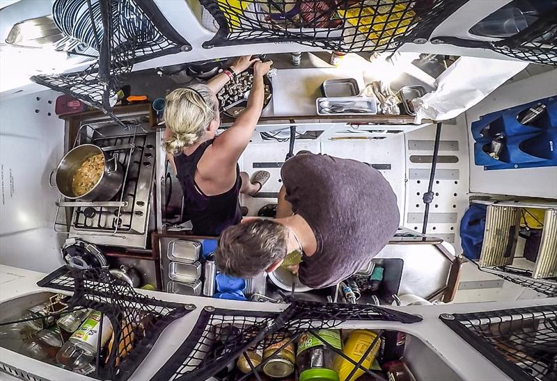 Life on board: Cooking in the galley, whilst the yacht is heeling - photo © Clipper Race