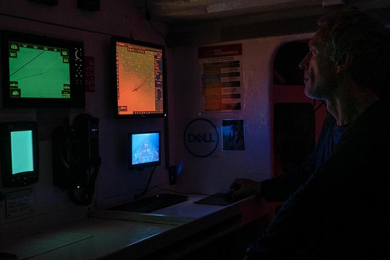 Clipper Race - Guy Waites in nav station at night - photo © Maeva Bardy