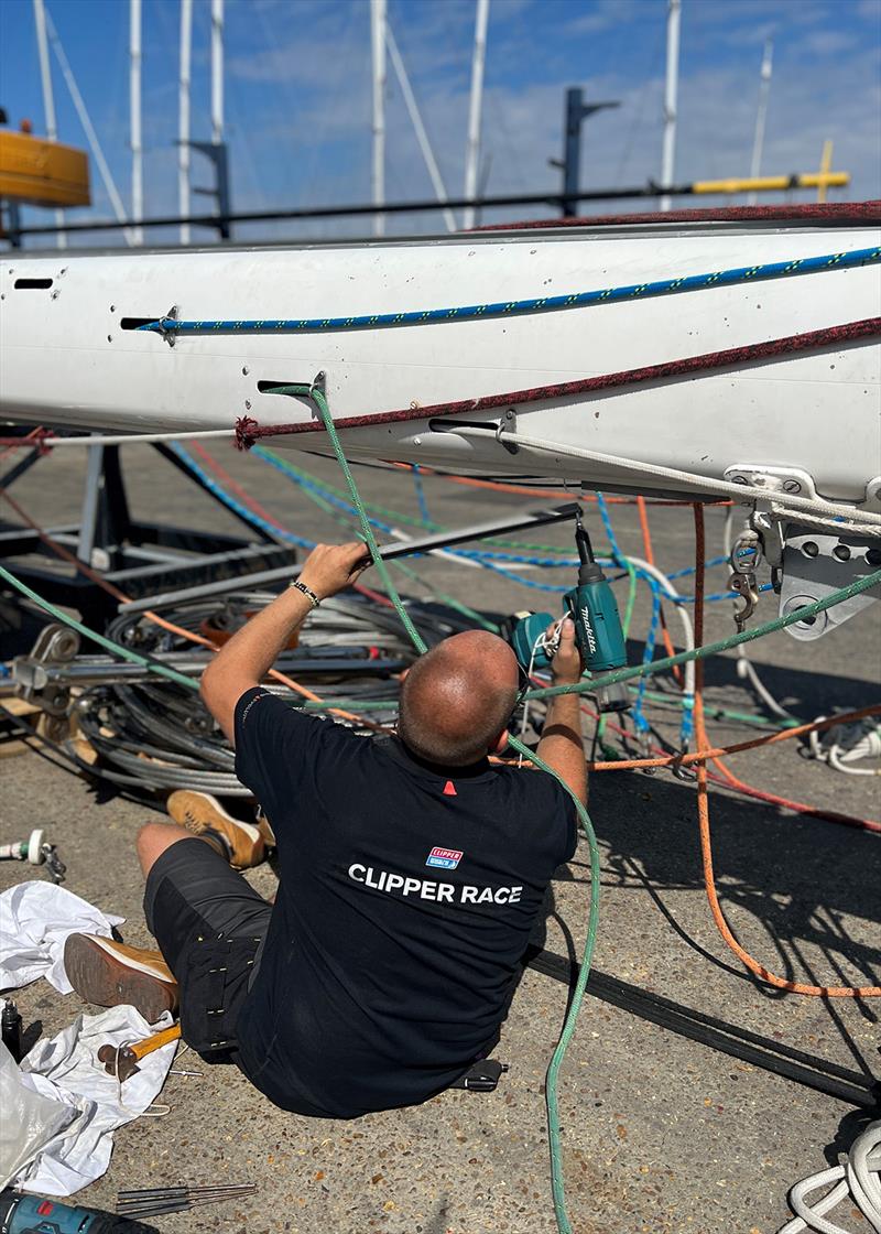 Rigger Andy Peck dissembles a Clipper 70 mast - photo © Clipper Race
