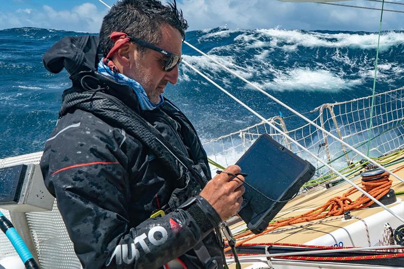Clipper 2019-20 Race Skipper Jeronimo Santos Gonzales using the software on deck in big conditions photo copyright Maeva Bardy taken at  and featuring the Clipper 70 class
