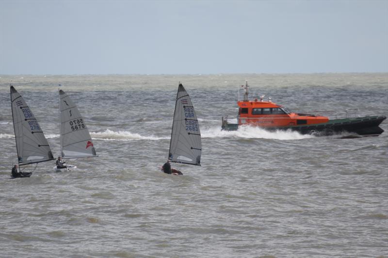 A pilot boat gives the already substantial swell a further stir during the Dyson Dash photo copyright Adrian Trice taken at Broadstairs Sailing Club and featuring the Contender class