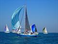 Sunbathing on Assent during the Round the Island Race 2026 &copy; Clive Hughes