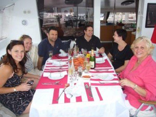 The Fraser family enjoying Christmas lunch afloat (from left): Daughter Fiona and DIL Lucinda, sons Scott and Tom and DIL Lauren, and Louise. (Gordon is not in shot as he is the photographer.) photo copyright Gordon Fraser taken at  and featuring the Cruising Yacht class